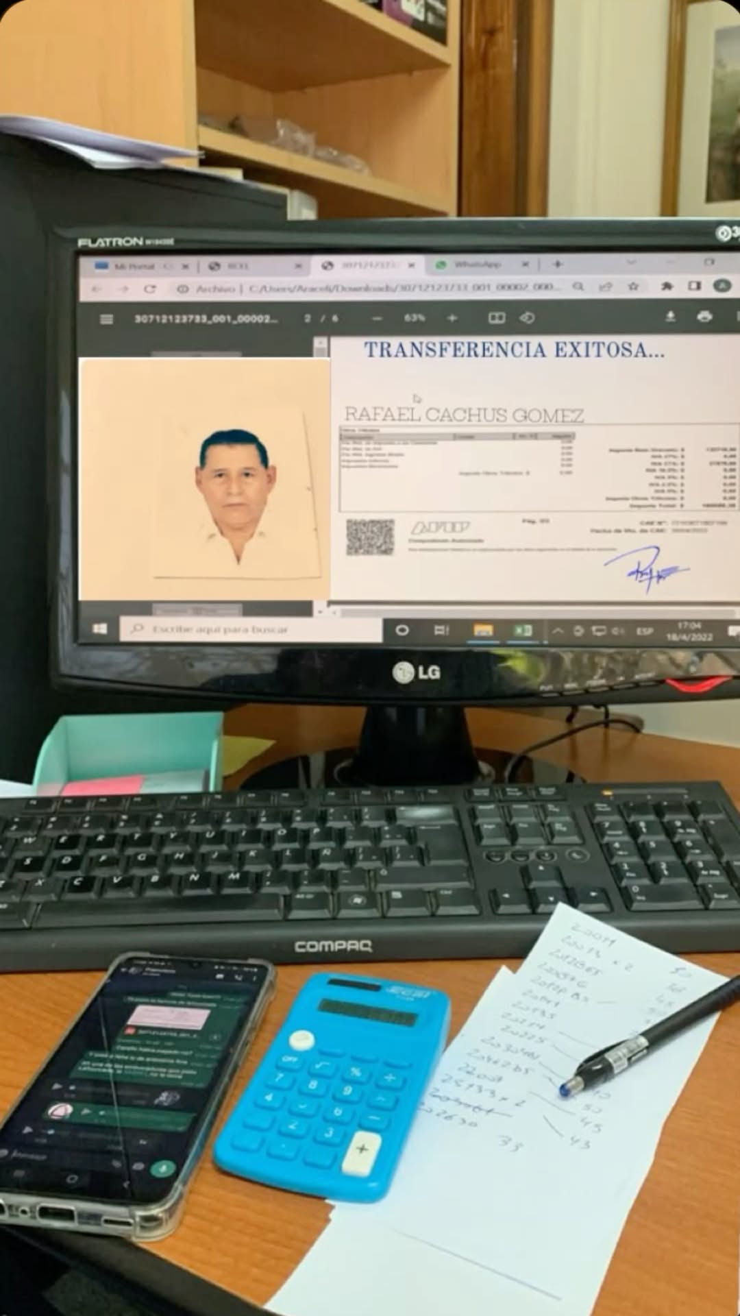 computer monitor on desk next to phone and keyboard